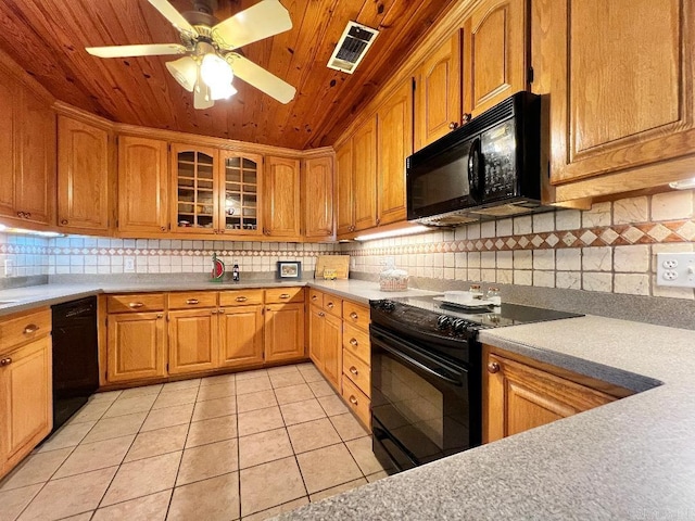 kitchen featuring wood ceiling, backsplash, light tile patterned floors, black appliances, and ceiling fan