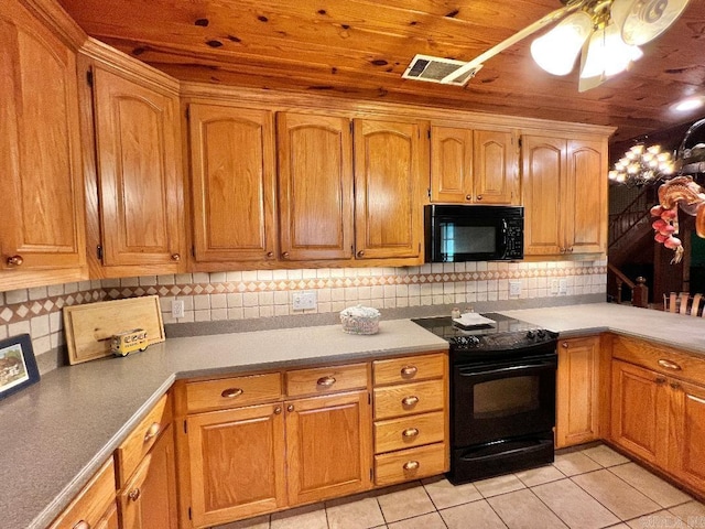 kitchen with wood ceiling, light tile patterned flooring, tasteful backsplash, black appliances, and ceiling fan