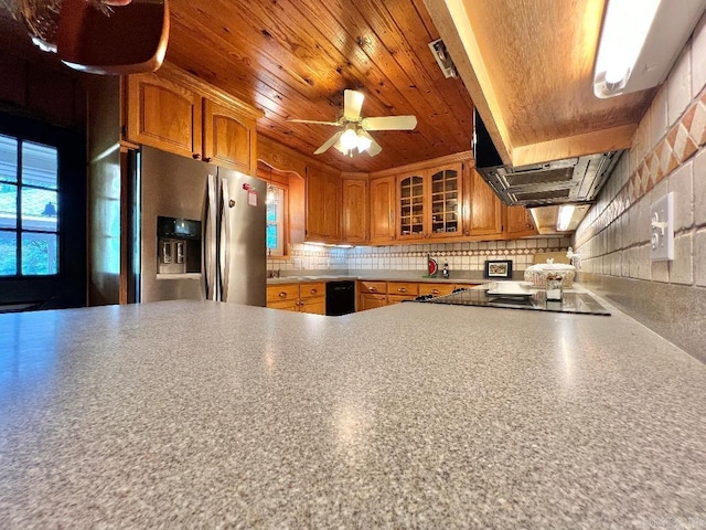 kitchen featuring black electric stovetop, tasteful backsplash, ceiling fan, wooden ceiling, and stainless steel fridge