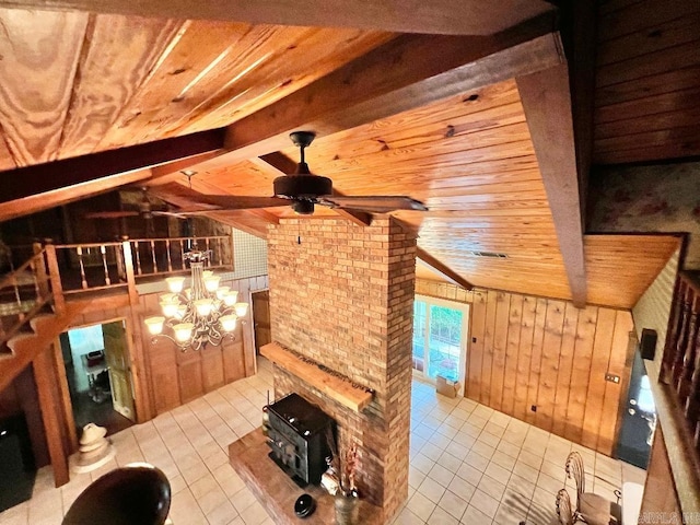 unfurnished living room with wood ceiling, light tile patterned flooring, ceiling fan with notable chandelier, wooden walls, and vaulted ceiling with beams