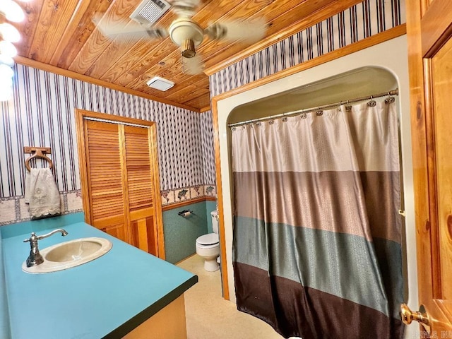 bathroom with vanity, wood ceiling, and toilet