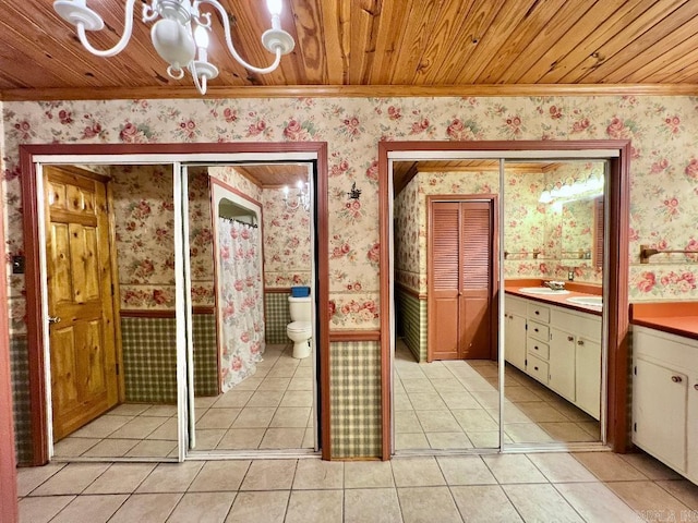 bathroom featuring wood ceiling, vanity, toilet, and tile patterned floors