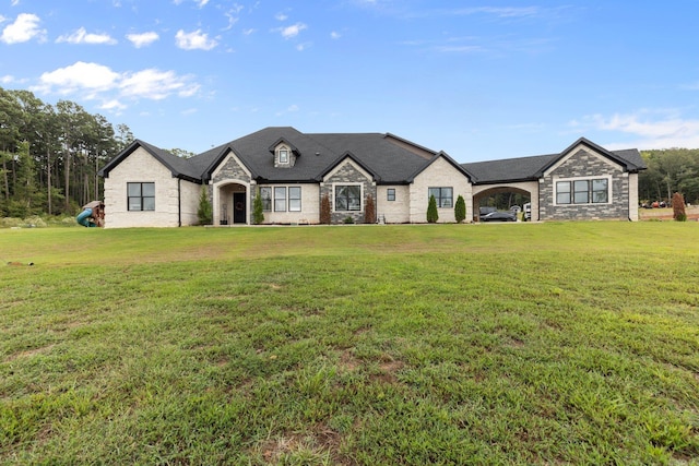 french country style house featuring a front yard