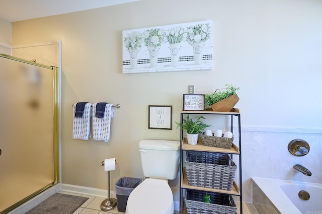 bathroom featuring shower with separate bathtub, tile patterned flooring, and toilet