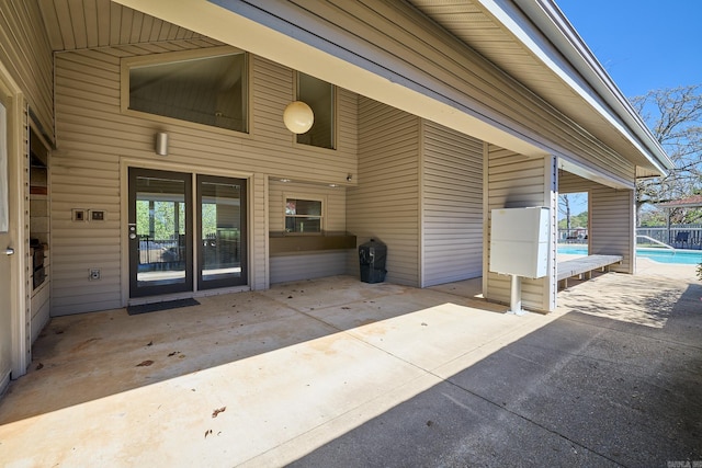 property entrance with a patio