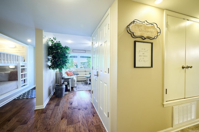 hallway featuring dark hardwood / wood-style flooring