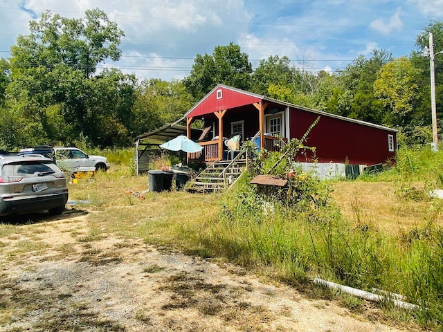 view of yard with covered porch