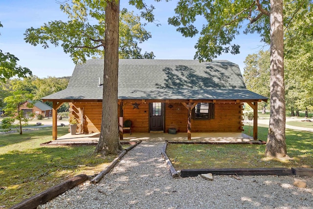 view of front of house with a porch and a front yard