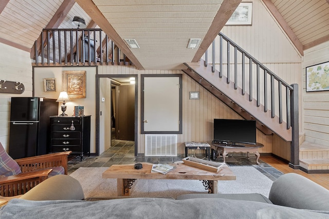 living room with wood ceiling, wooden walls, wood-type flooring, and high vaulted ceiling