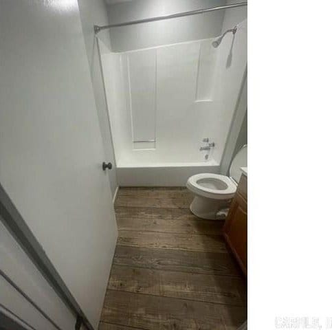 full bathroom featuring bathing tub / shower combination, vanity, toilet, and hardwood / wood-style floors