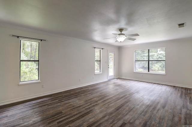 spare room featuring ornamental molding, dark hardwood / wood-style floors, and ceiling fan