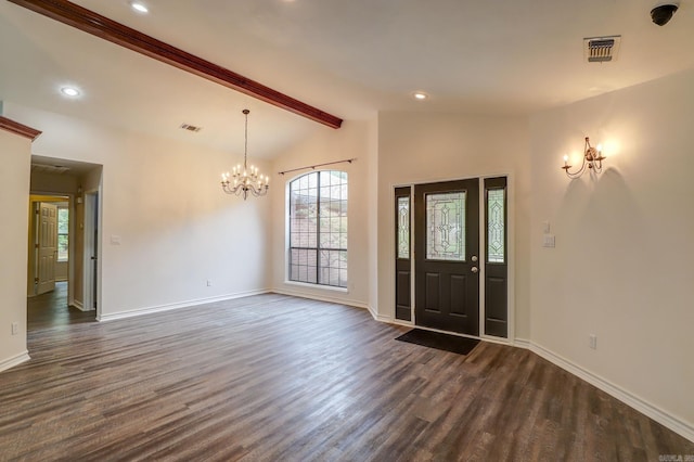 entrance foyer featuring an inviting chandelier, lofted ceiling with beams, and dark wood-type flooring