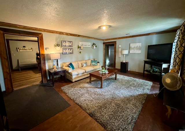 living room featuring a textured ceiling, crown molding, and dark hardwood / wood-style flooring