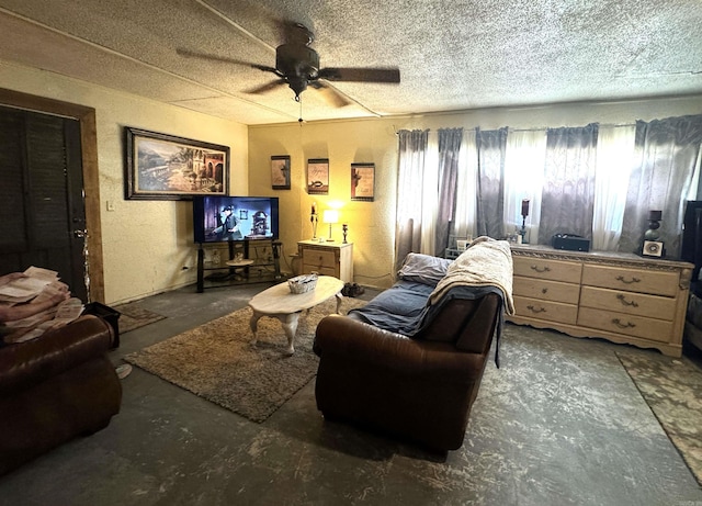 living room featuring a textured ceiling and ceiling fan