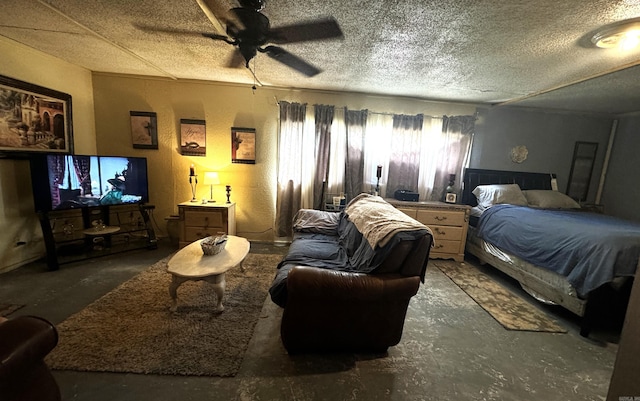 bedroom with a textured ceiling, concrete floors, and ceiling fan