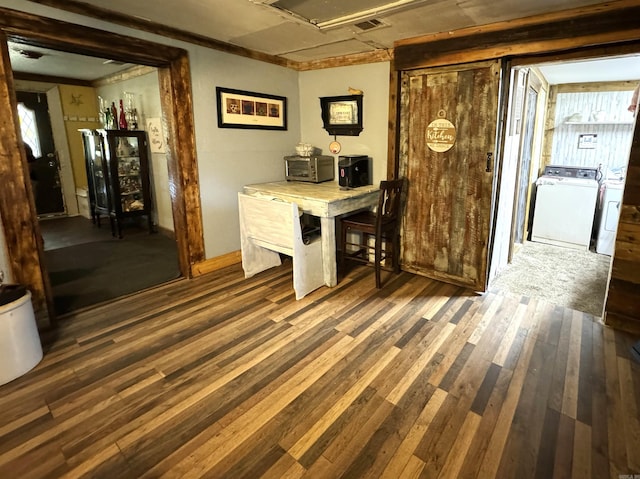 office space featuring dark wood-type flooring and washing machine and clothes dryer