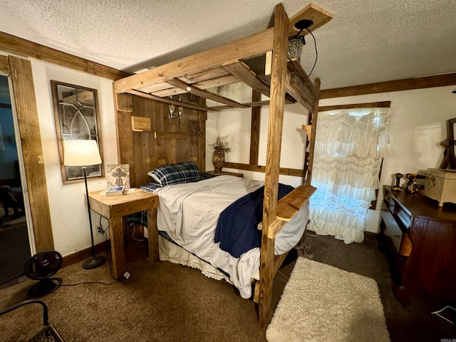 bedroom featuring a textured ceiling and carpet floors