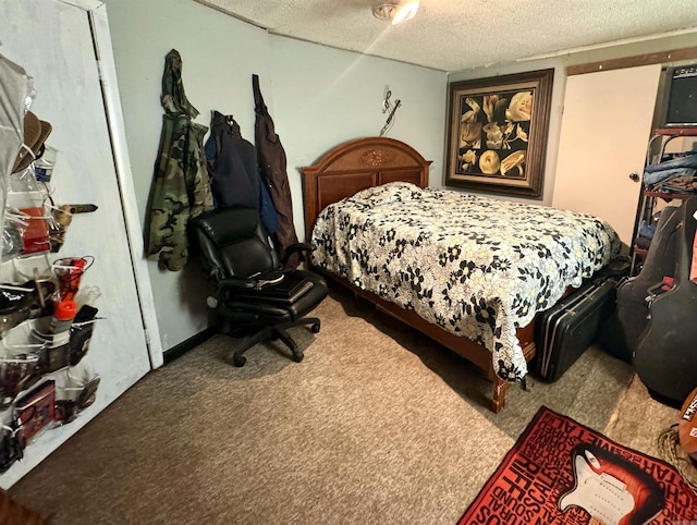 bedroom with a textured ceiling and carpet