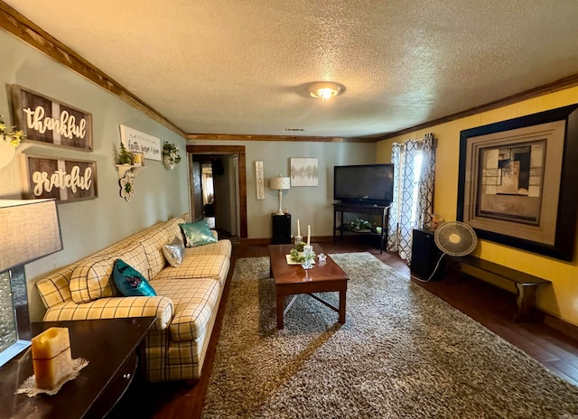 living room featuring ornamental molding, a textured ceiling, and dark hardwood / wood-style floors