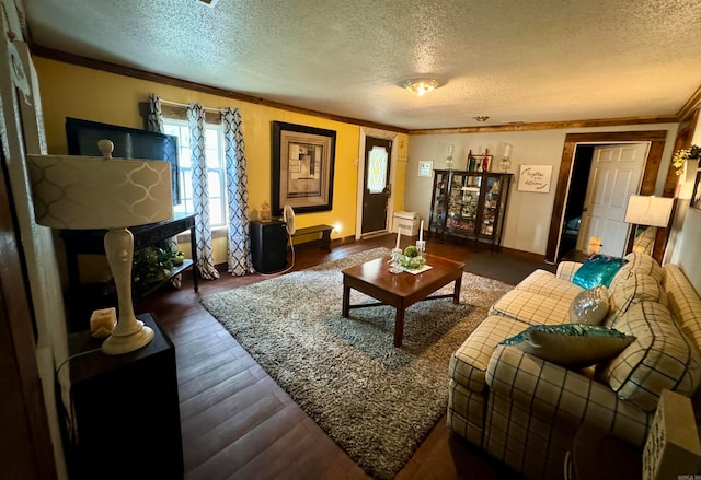 living room with a textured ceiling, dark hardwood / wood-style floors, and crown molding