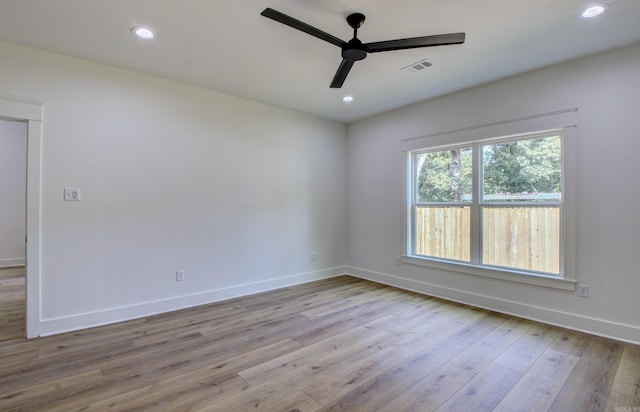 unfurnished room featuring light hardwood / wood-style floors and ceiling fan