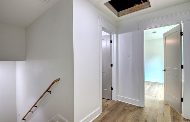 hallway with light hardwood / wood-style flooring