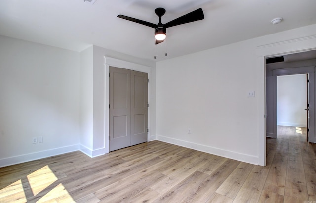 empty room featuring light hardwood / wood-style floors and ceiling fan