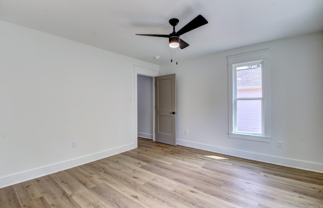 spare room with light hardwood / wood-style flooring and ceiling fan