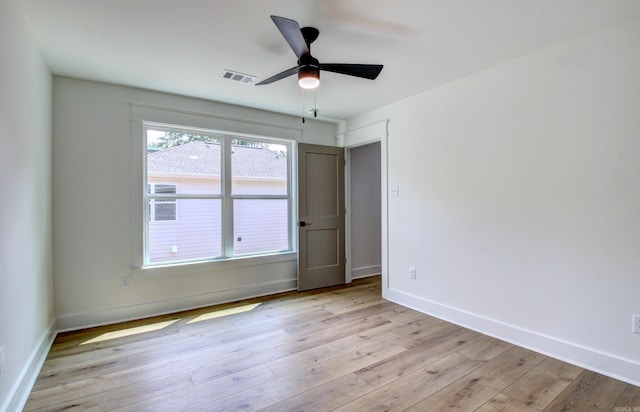 spare room featuring ceiling fan and light hardwood / wood-style flooring