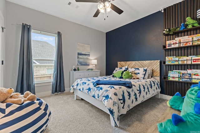 bedroom with ceiling fan and carpet floors