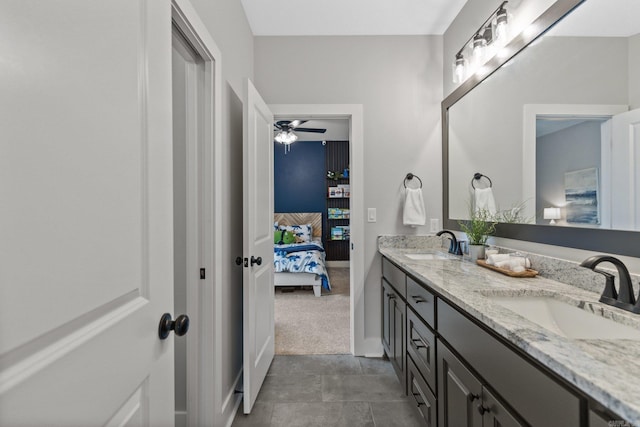 bathroom with tile patterned floors, ceiling fan, and vanity