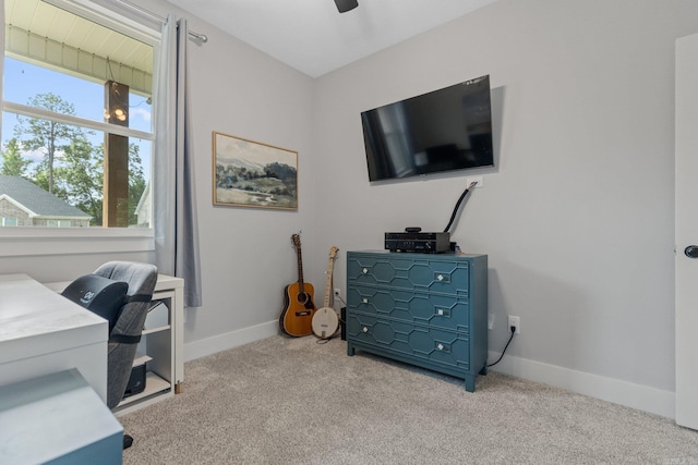 home office featuring carpet and ceiling fan