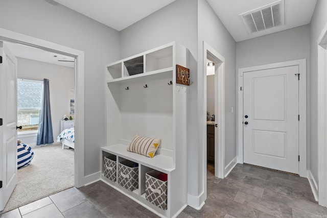 mudroom featuring carpet