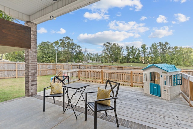 wooden deck with a patio