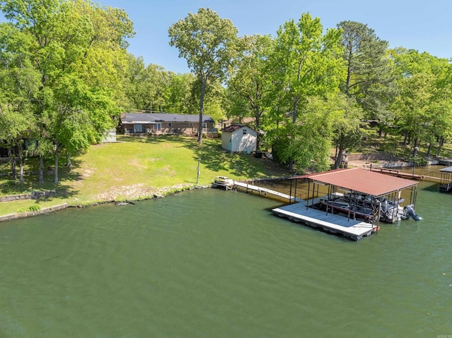 view of dock featuring a water view and a lawn