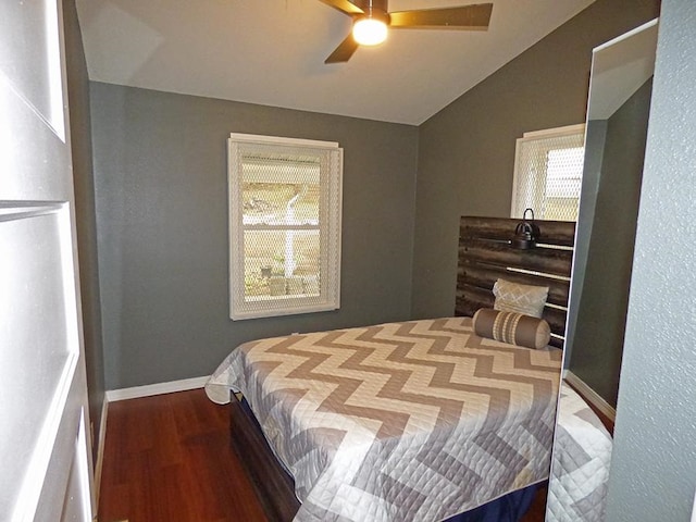 bedroom featuring ceiling fan, hardwood / wood-style flooring, and vaulted ceiling