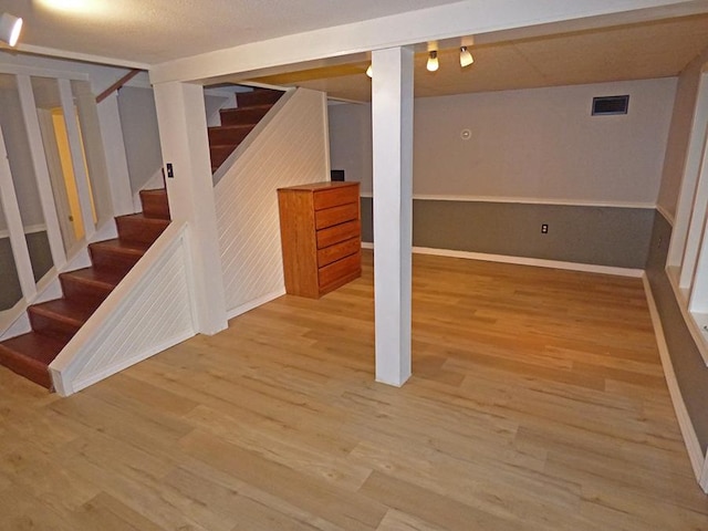 basement featuring hardwood / wood-style flooring