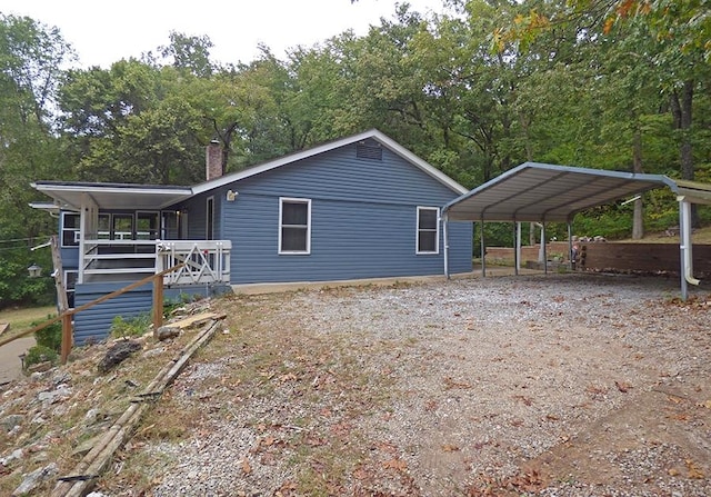 exterior space featuring a carport