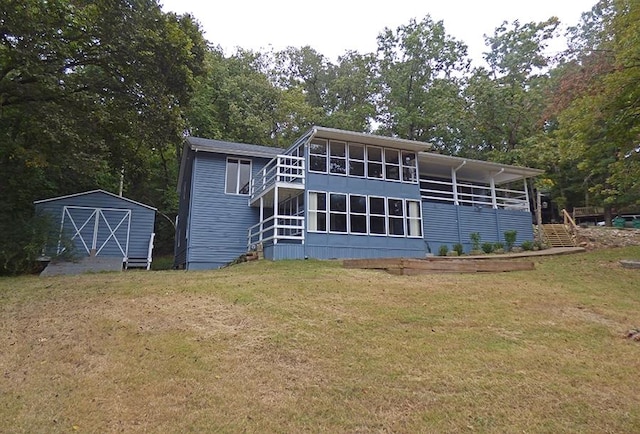 exterior space with a storage unit and a front lawn