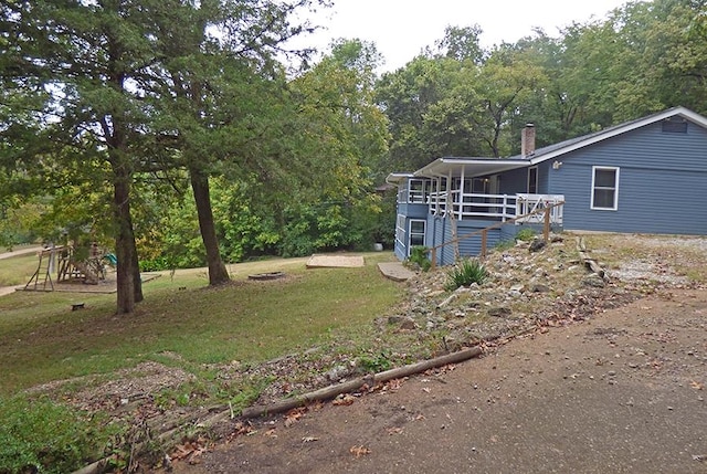 view of yard with a wooden deck