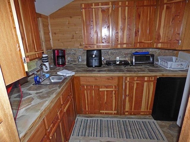 kitchen featuring decorative backsplash and sink