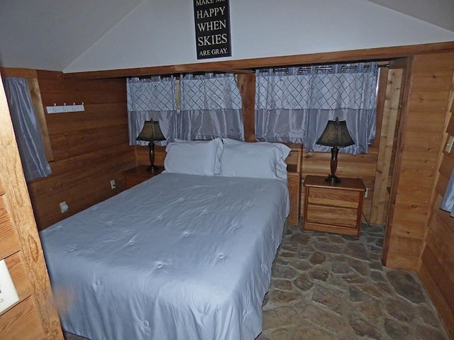 bedroom with wooden walls