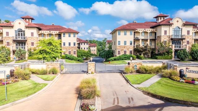 view of property's community with a lawn