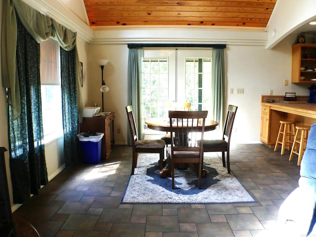 dining area featuring wooden ceiling, lofted ceiling, and french doors