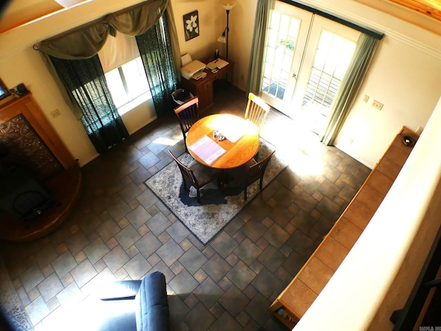 living room featuring french doors and a healthy amount of sunlight