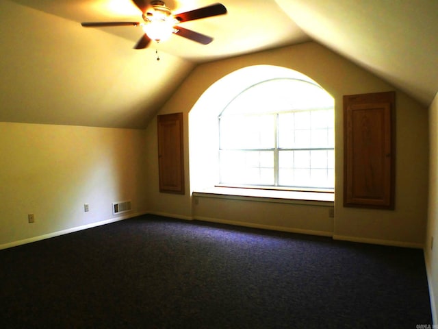 bonus room featuring ceiling fan, carpet flooring, and vaulted ceiling