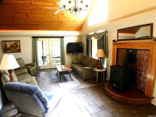 living room featuring wood ceiling, a wood stove, lofted ceiling, an inviting chandelier, and french doors