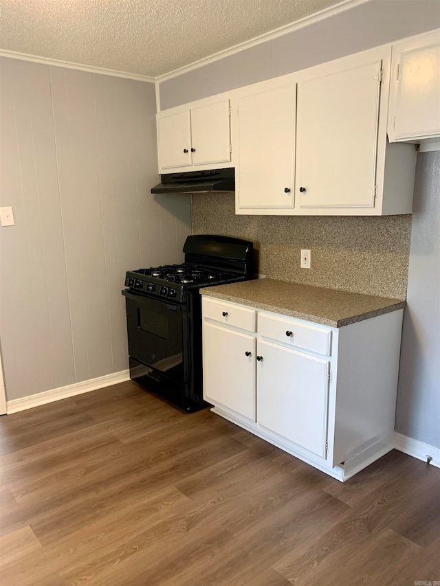 kitchen featuring decorative backsplash, black range with gas cooktop, dark wood-type flooring, and white cabinets