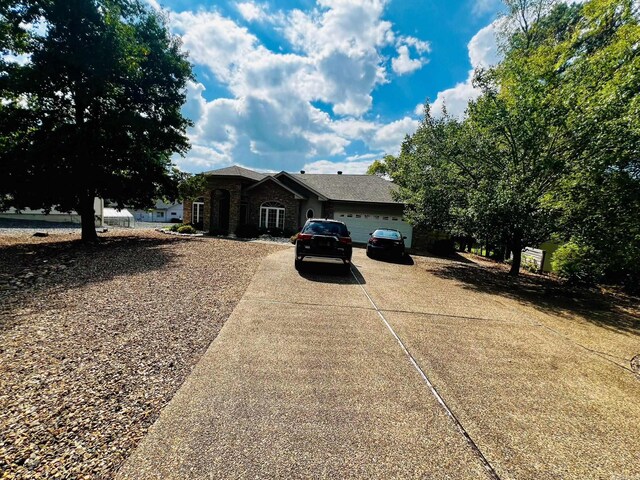 ranch-style home featuring a garage