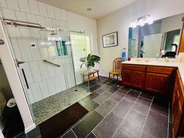 bathroom with vanity and an enclosed shower